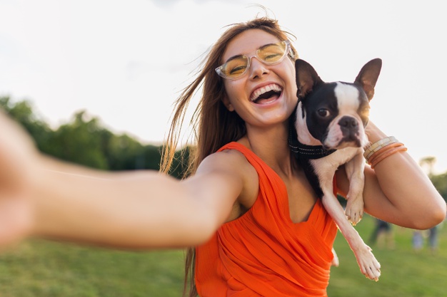 happy-pretty-woman-park-making-selfie-photo-holding-boston-terrier-dog-smiling-positive-mood-trendy-summer-style-wearing-orange-dress-sunglasses-playing-with-pet-having-fun_285396-5152